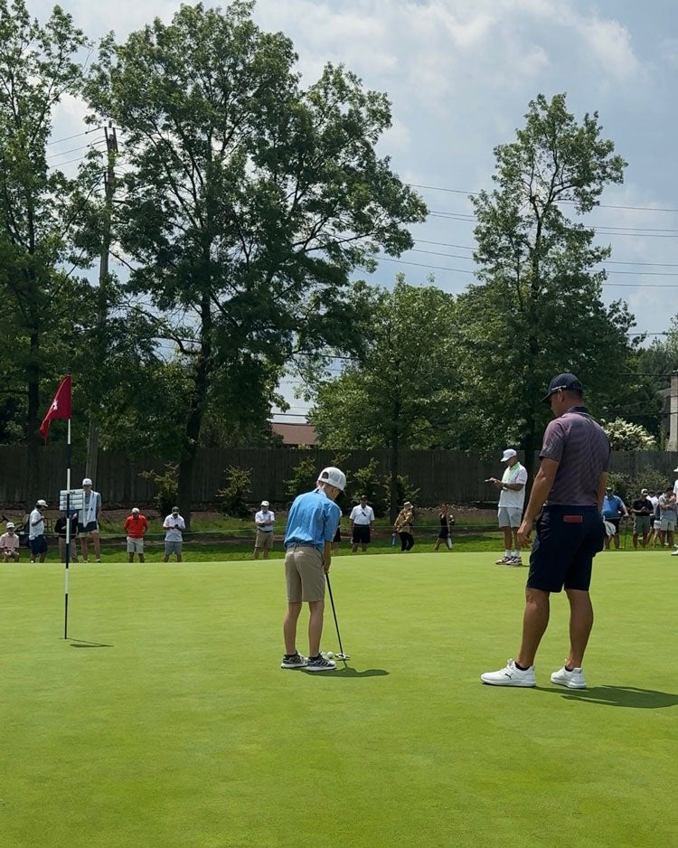 Silas and Gary Woodland at Oakmont.
