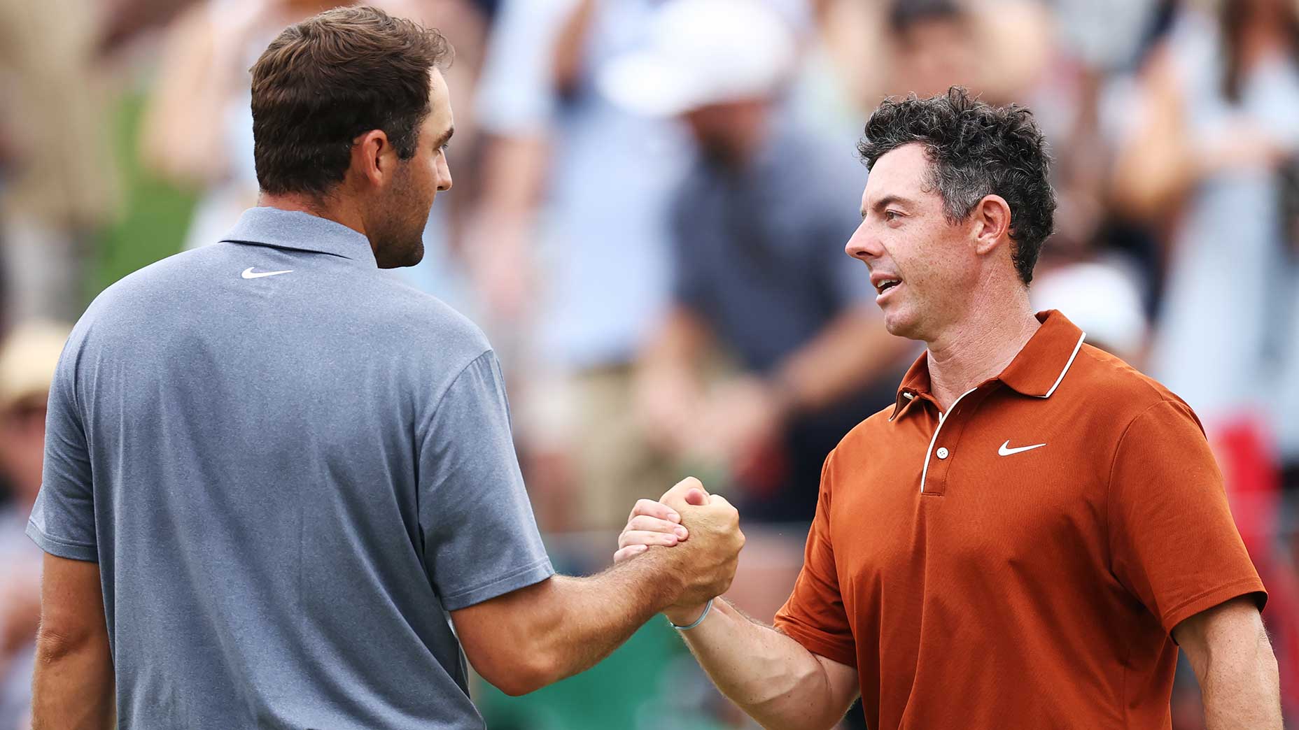 Scottie Scheffler and Rory McIlroy shake hands at the 2025 PGA Championship.