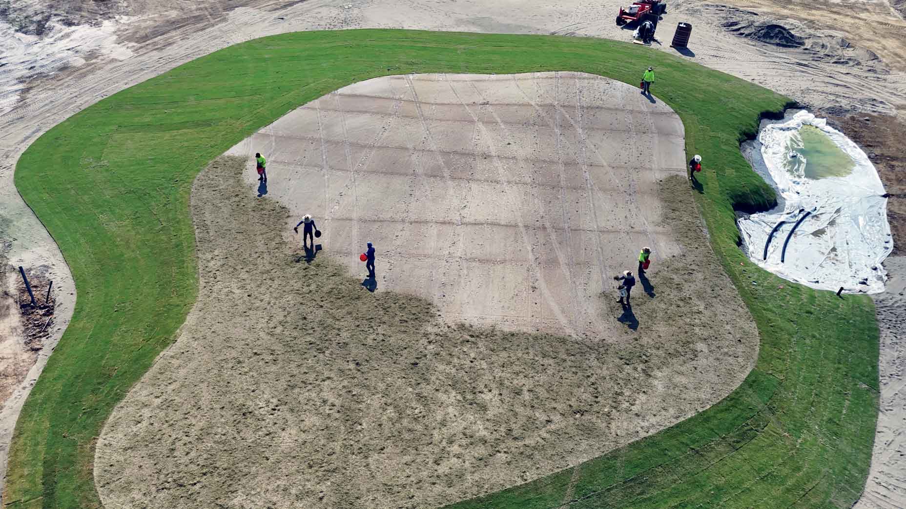 At the King-Collins–designed Bounty Club, a ground crew sprigs the 14th green.