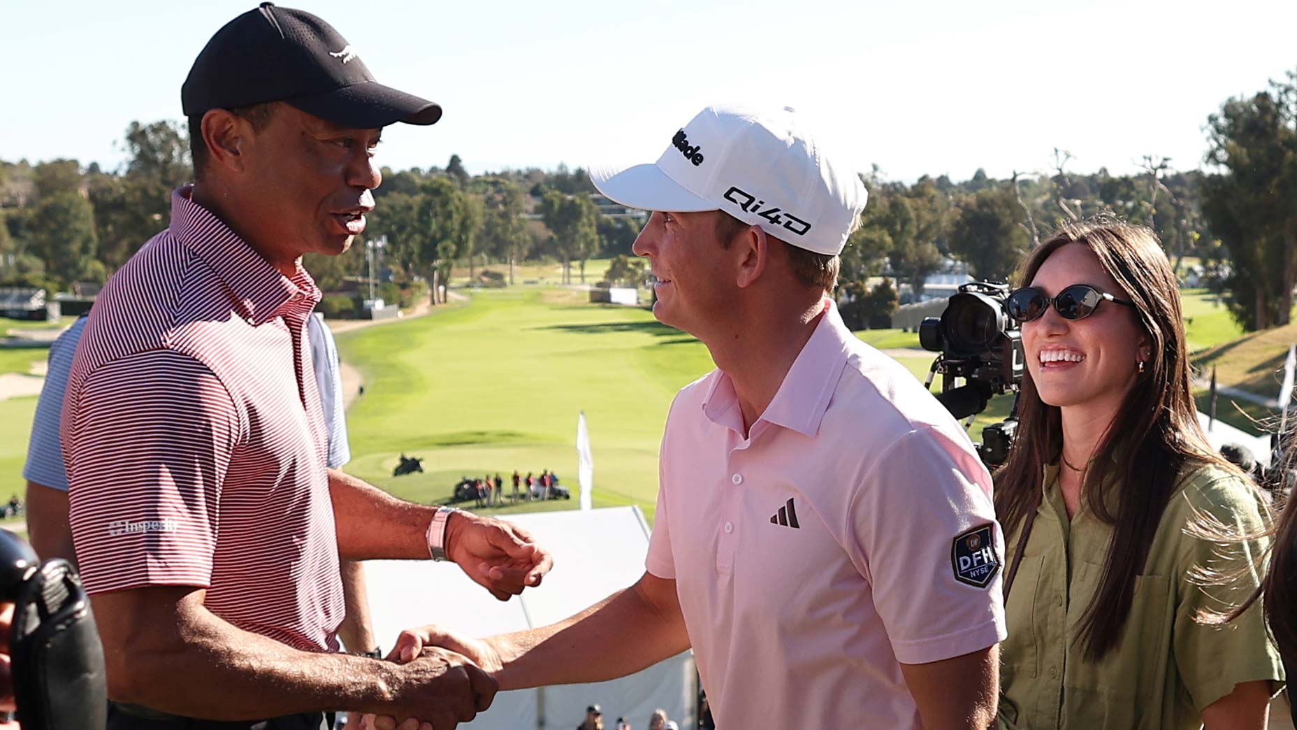 Tiger Woods, Jacob Bridgeman and a well-earned handshake.