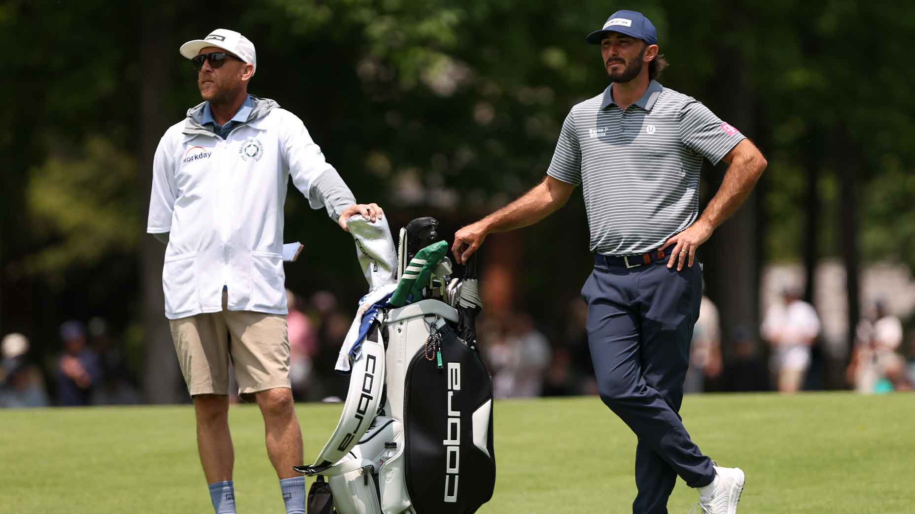 max homa and bill harke stand next to the bag at the Memorial Tournament in Dublin, Ohio