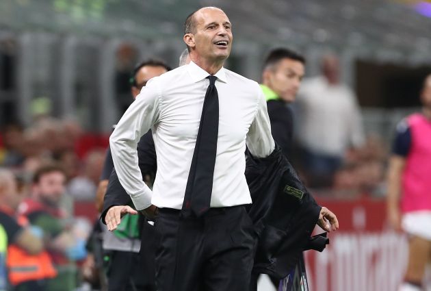 Max Allegri taking off his jacket