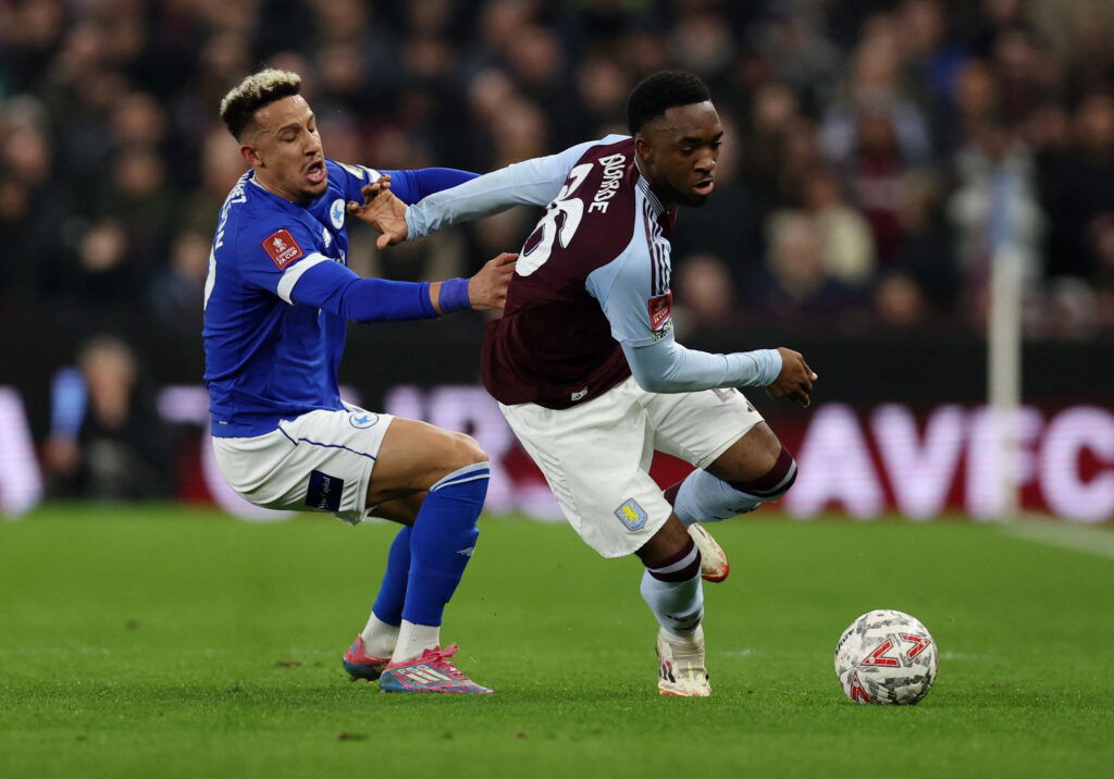 Lamare Bogarde of Aston Villa battling with Cardiff City's Callum Robinson